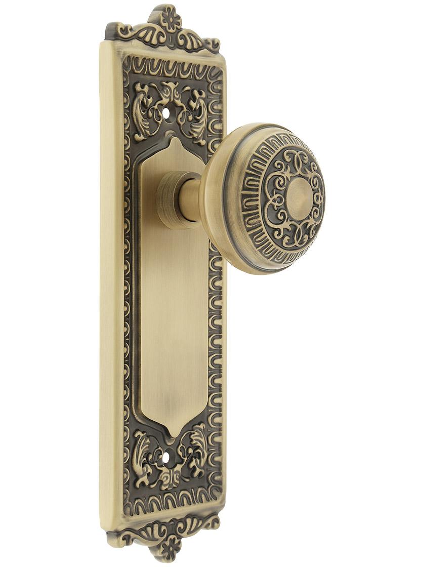 Egg and Dart Style Door Set with Egg and Dart Knobs Single Dummy in Antique Brass.